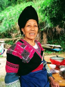 Yao minority woman cooking lunch in Longji rice terraces